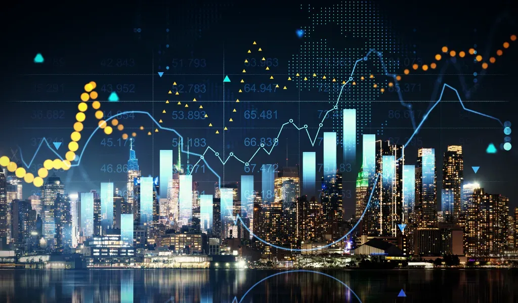 Cyfrowe wykresy giełdowe zaprezentowane na tle panoramy Manhattanu